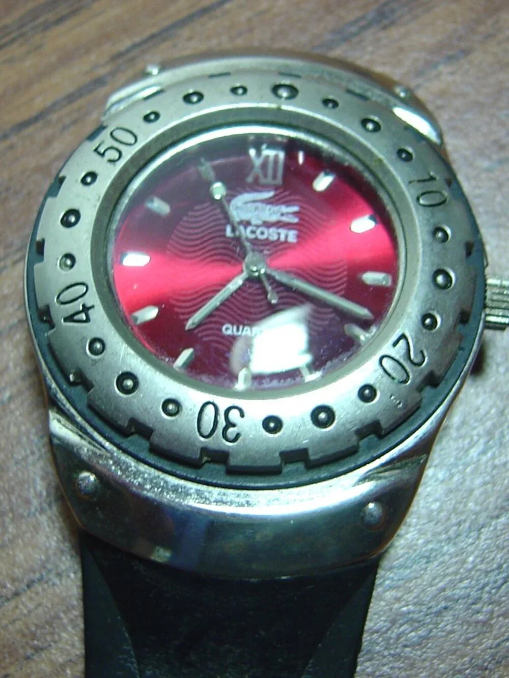 Men's Lacoste quartz watch-red dial-alligator design on dial-needs a band